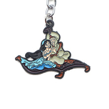 Load image into Gallery viewer, Aladdin with Jasmine on magic Carpet Keychain